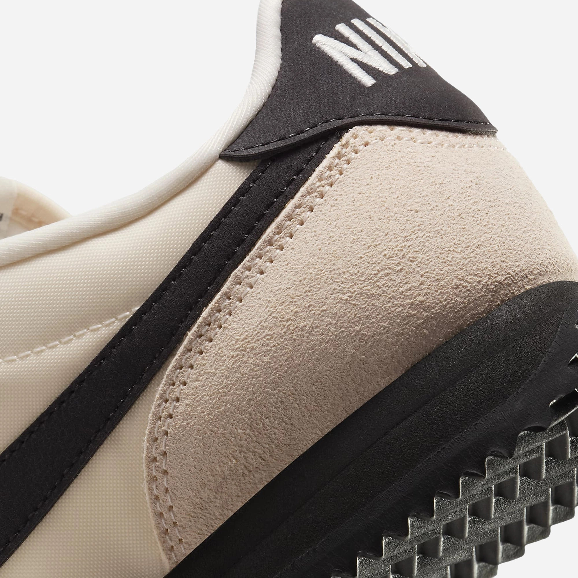 NIKE | CORTEZ TEXTILE { GUAVA ICE/BLACK-SAIL-PHANTOM